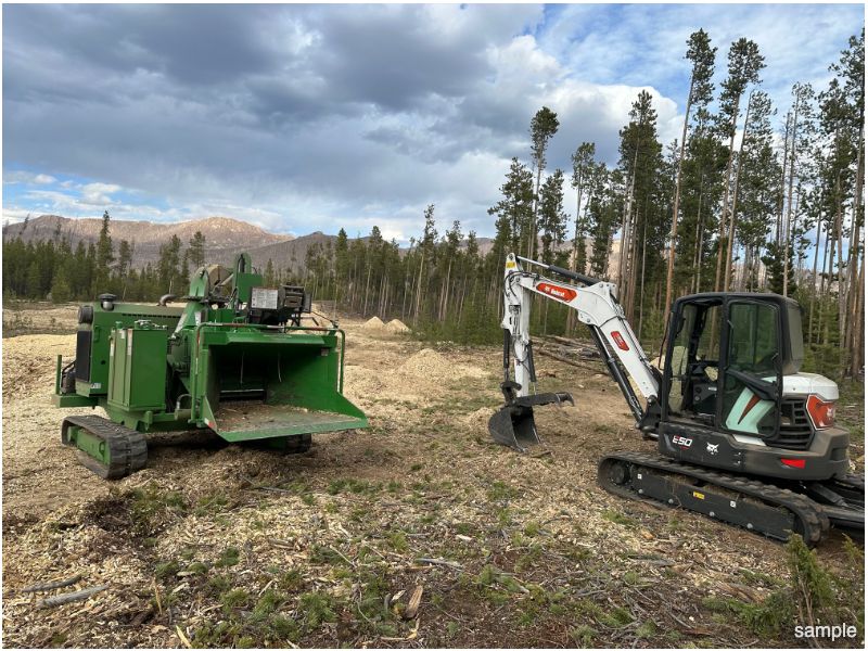 Bobcat E50 & Bandit tracked whole tree chipper used for land clearing.